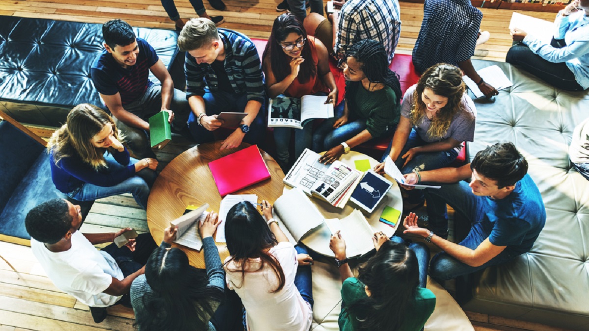 Students around a table studying